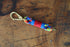 Rainbow Key Chain with Light Blue & Red Whipping